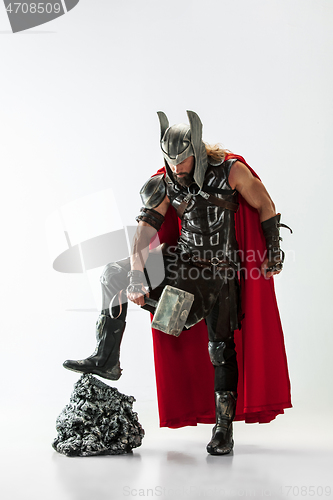 Image of Man in cosplaying Thor isolated on white studio background