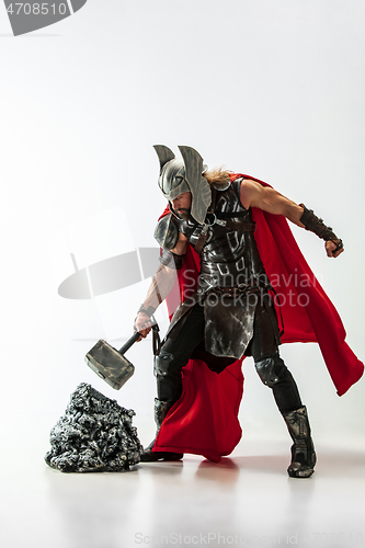 Image of Man in cosplaying Thor isolated on white studio background