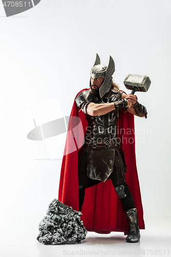 Image of Man in cosplaying Thor isolated on white studio background