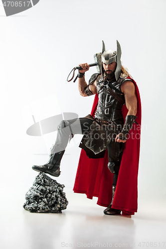 Image of Man in cosplaying Thor isolated on white studio background