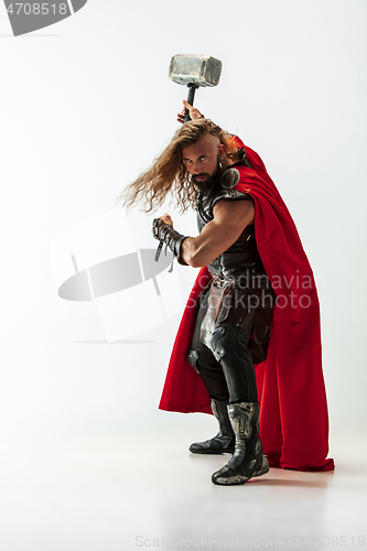 Image of Man in cosplaying Thor isolated on white studio background