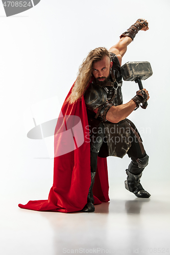 Image of Man in cosplaying Thor isolated on white studio background