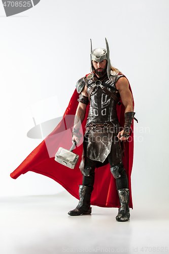 Image of Man in cosplaying Thor isolated on white studio background