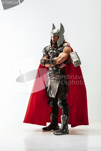 Image of Man in cosplaying Thor isolated on white studio background