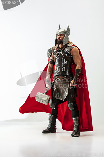 Image of Man in cosplaying Thor isolated on white studio background