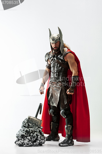 Image of Man in cosplaying Thor isolated on white studio background