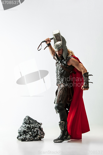 Image of Man in cosplaying Thor isolated on white studio background