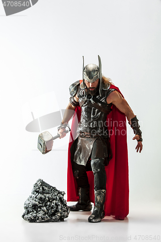 Image of Man in cosplaying Thor isolated on white studio background