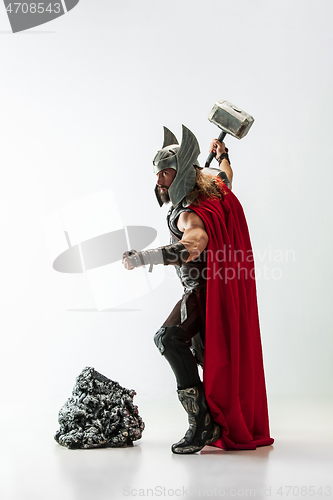 Image of Man in cosplaying Thor isolated on white studio background