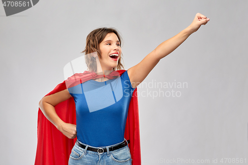 Image of happy woman in red superhero cape