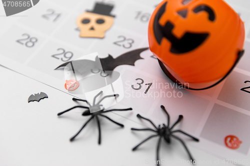 Image of halloween party decorations and day in calendar