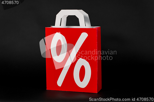 Image of red shopping bag with percentage sign