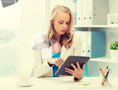 Image of businesswoman or student with tablet pc at office