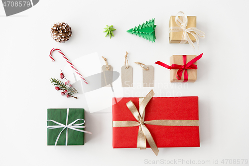 Image of set of christmas gifts, tags and decorations