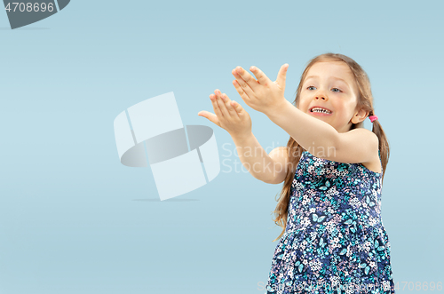 Image of Beautiful emotional little girls isolated on blue background