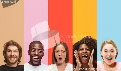 Image of Young attractive people looking astonished on multicolored background