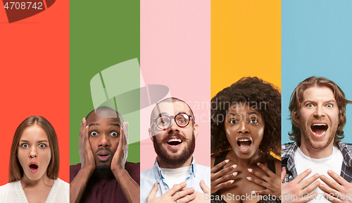 Image of Young attractive people looking astonished on multicolored background