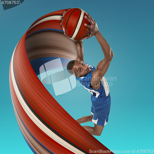 Image of Full length portrait of a basketball player with ball