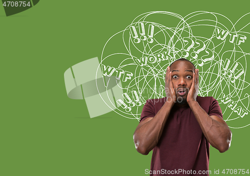 Image of Young african-american man with mixed thoughts