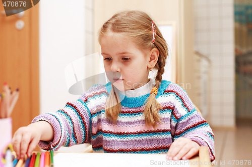 Image of Cute little girl painting