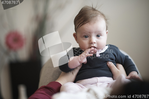 Image of mother is playing with baby at home