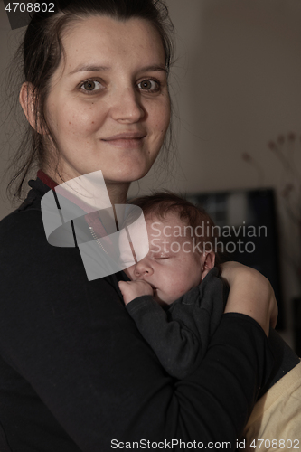 Image of mother is playing with baby at home