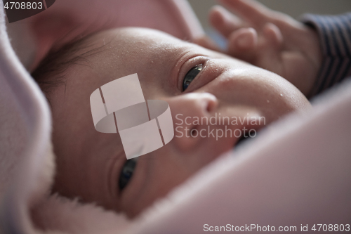 Image of One month newborn baby sleeping in bed