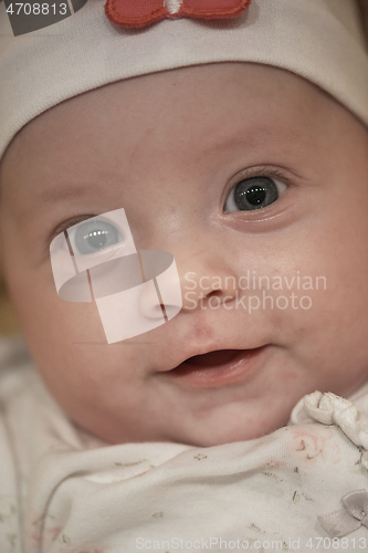 Image of portrait of happy newborn little baby smilling