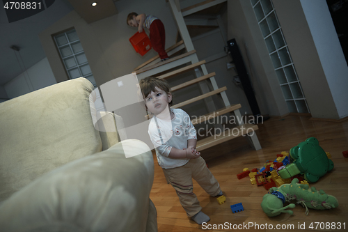 Image of Adorable cute beautiful little baby girl playing with toys at home