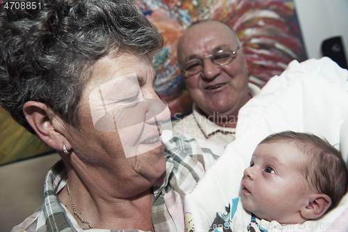 Image of family portrait with grandparents parents and baby