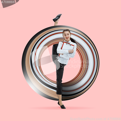 Image of Woman working at office and jumping isolated on studio background