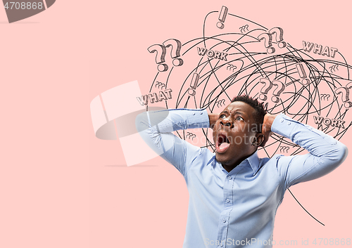 Image of Young african-american man with mixed thoughts