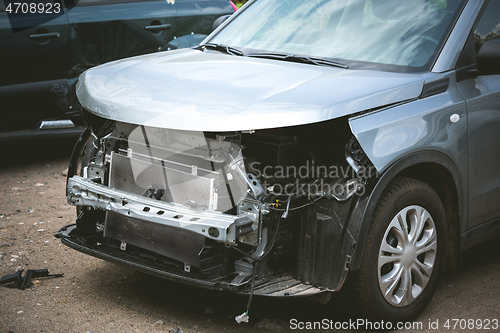 Image of Broken and crashed modern car after an accident on street