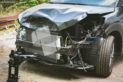 Image of Broken and crashed modern car after an accident on street
