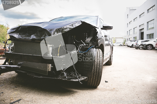 Image of Broken and crashed modern car after an accident on street