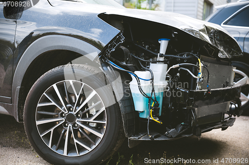 Image of Broken and crashed modern car after an accident on street