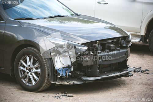 Image of Broken and crashed modern car after an accident on street