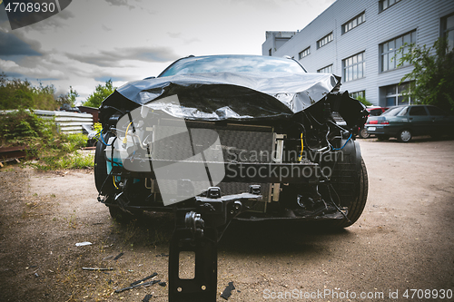 Image of Broken and crashed modern car after an accident on street