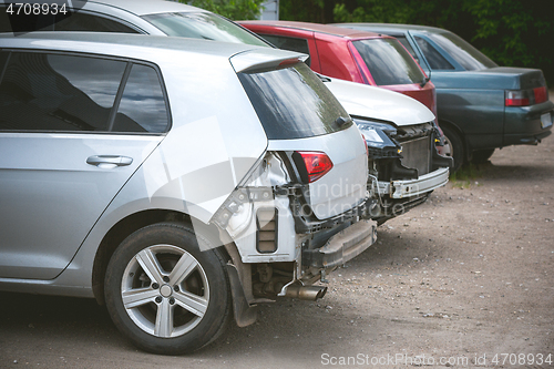 Image of Broken and crashed modern cars after an accident on street