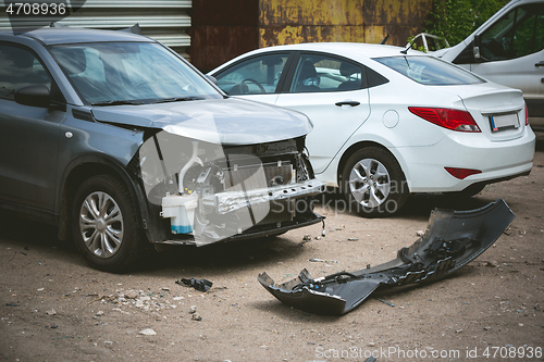 Image of Broken and crashed modern cars after an accident on street