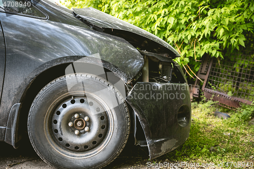 Image of Broken and crashed modern car after an accident on street