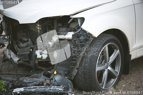 Image of Broken and crashed modern car after an accident on street