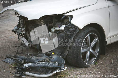 Image of Broken and crashed modern car after an accident on street