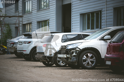 Image of Broken and crashed modern car after an accident on street