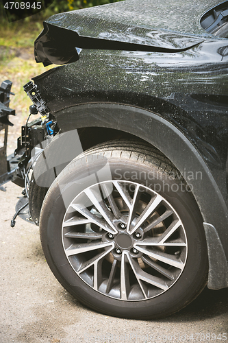 Image of Broken and crashed modern car after an accident on street