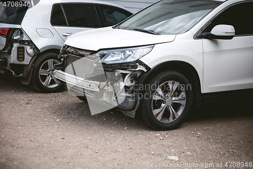 Image of Broken and crashed modern car after an accident on street