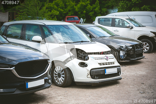 Image of Broken and crashed modern cars after an accident on street