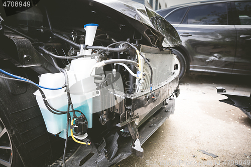 Image of Broken and crashed modern car after an accident on street