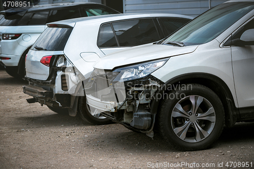 Image of Broken and crashed modern cars after an accident on street