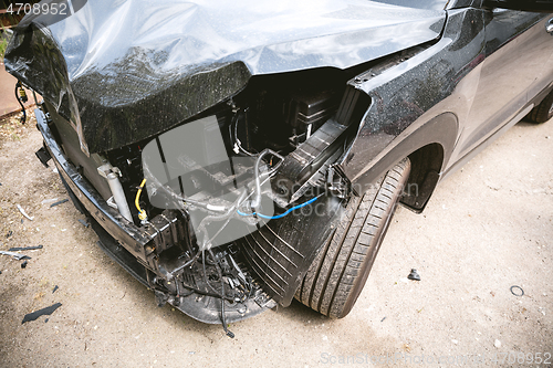 Image of Broken and crashed modern car after an accident on street